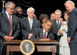 President Obama signing the Dodd-Frank Act